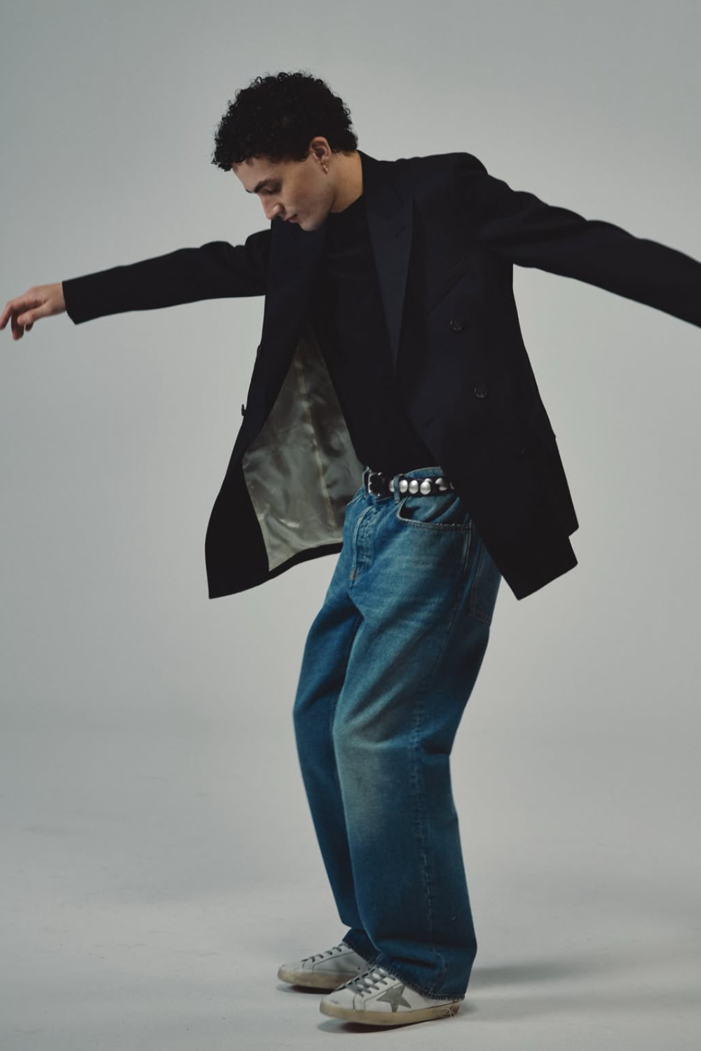 Golden Goose signature Superstar sneakers in white, grey, and black colorways featuring iconic star motif, distressed detailing, and vintage-inspired sole design