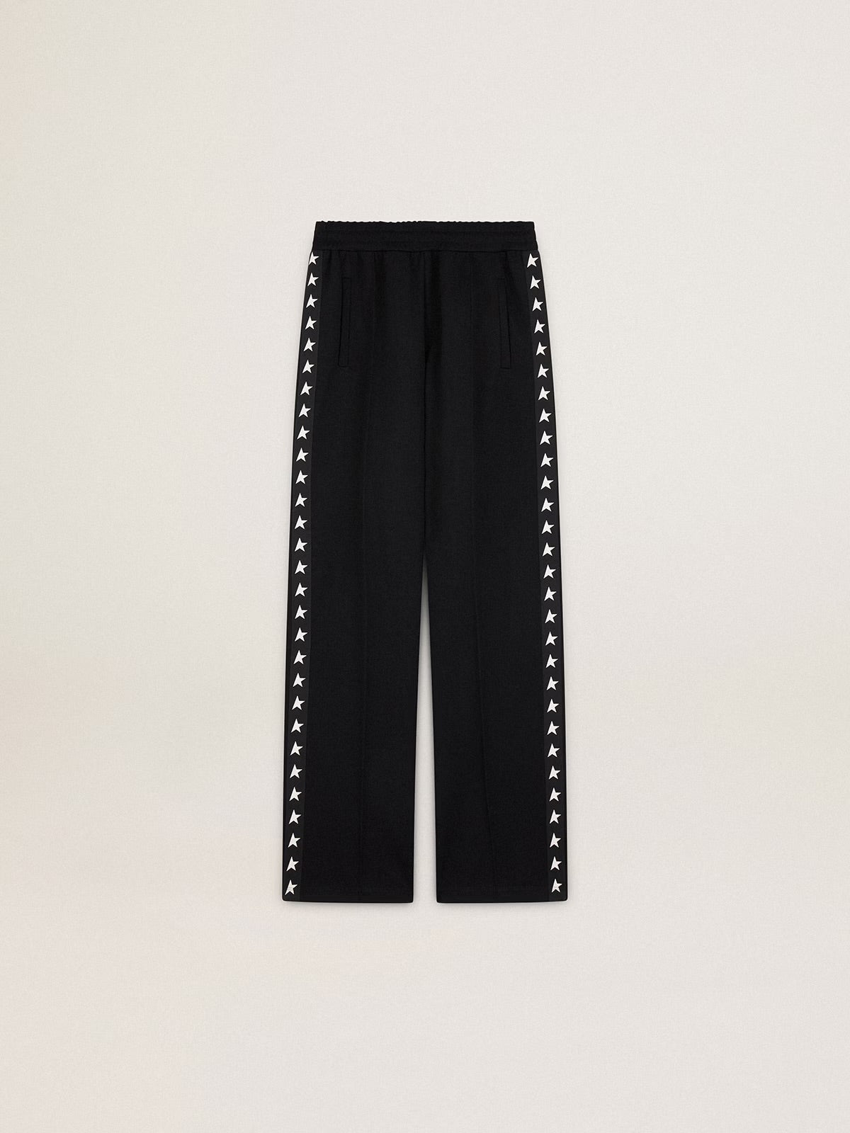 Women’s black joggers with white stars on the sides