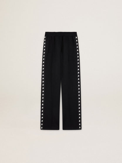 Women’s black joggers with white stars on the sides