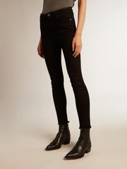 Woman’s black skinny jeans