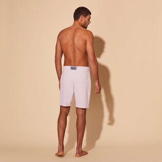 Man white linen Bermuda shorts