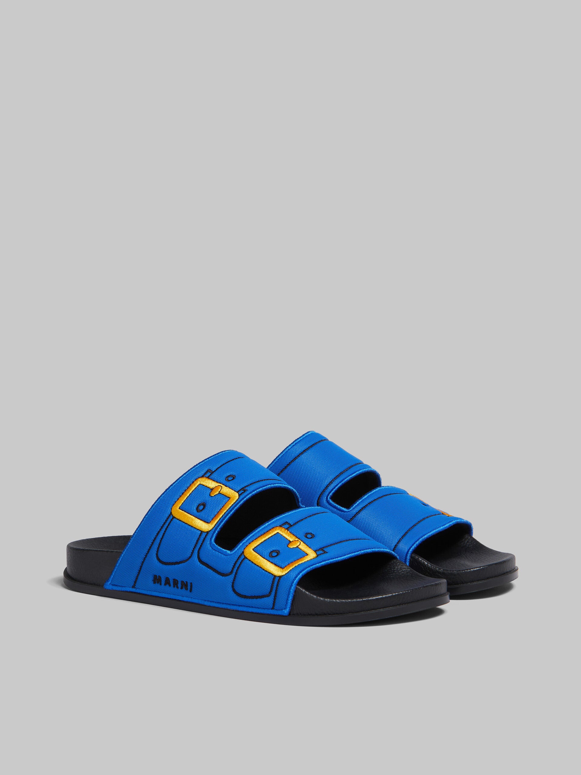 BLUE TROMPE L'OEIL SLIDER WITH EMBROIDERED BUCKLES