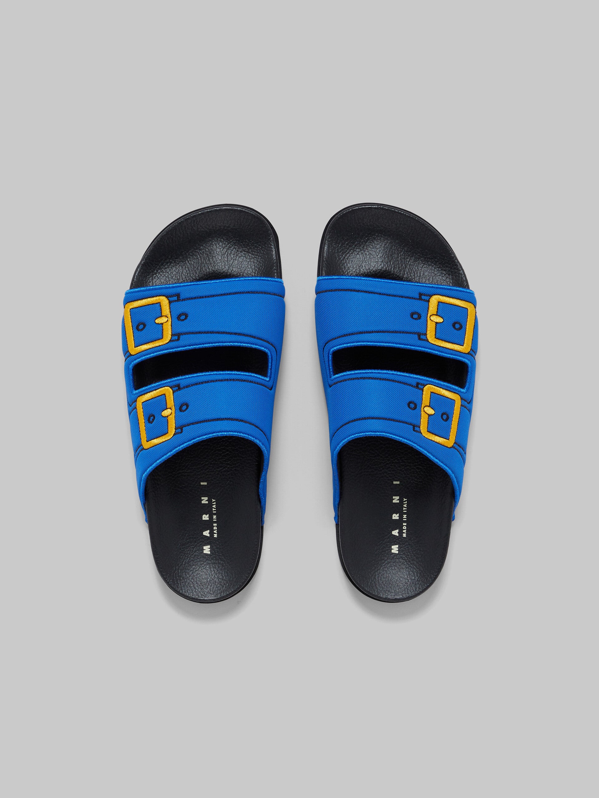 BLUE TROMPE L'OEIL SLIDER WITH EMBROIDERED BUCKLES