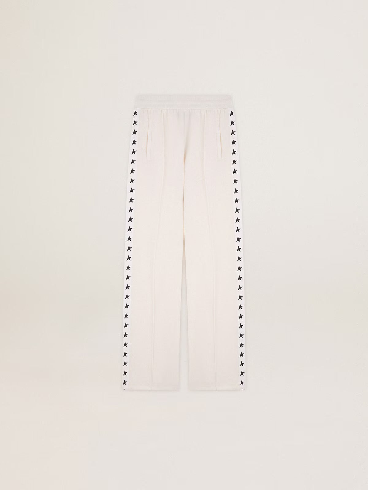 Women’s white joggers with black stars on the sides