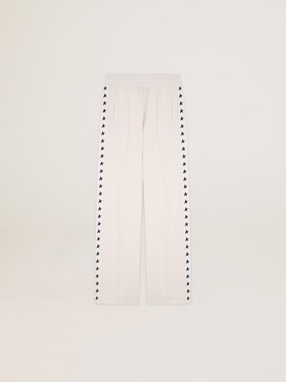 Women’s white joggers with black stars on the sides