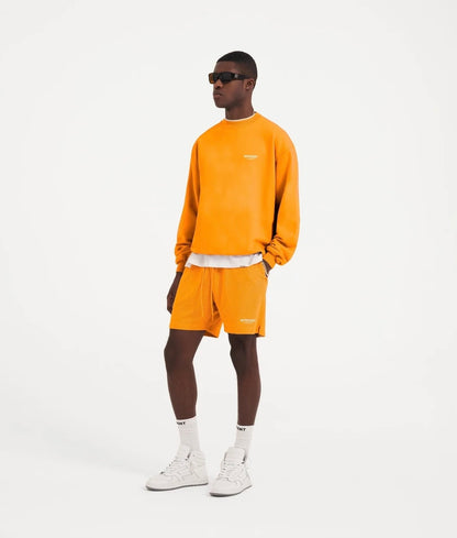 Neon orange logo print mesh bermuda shorts