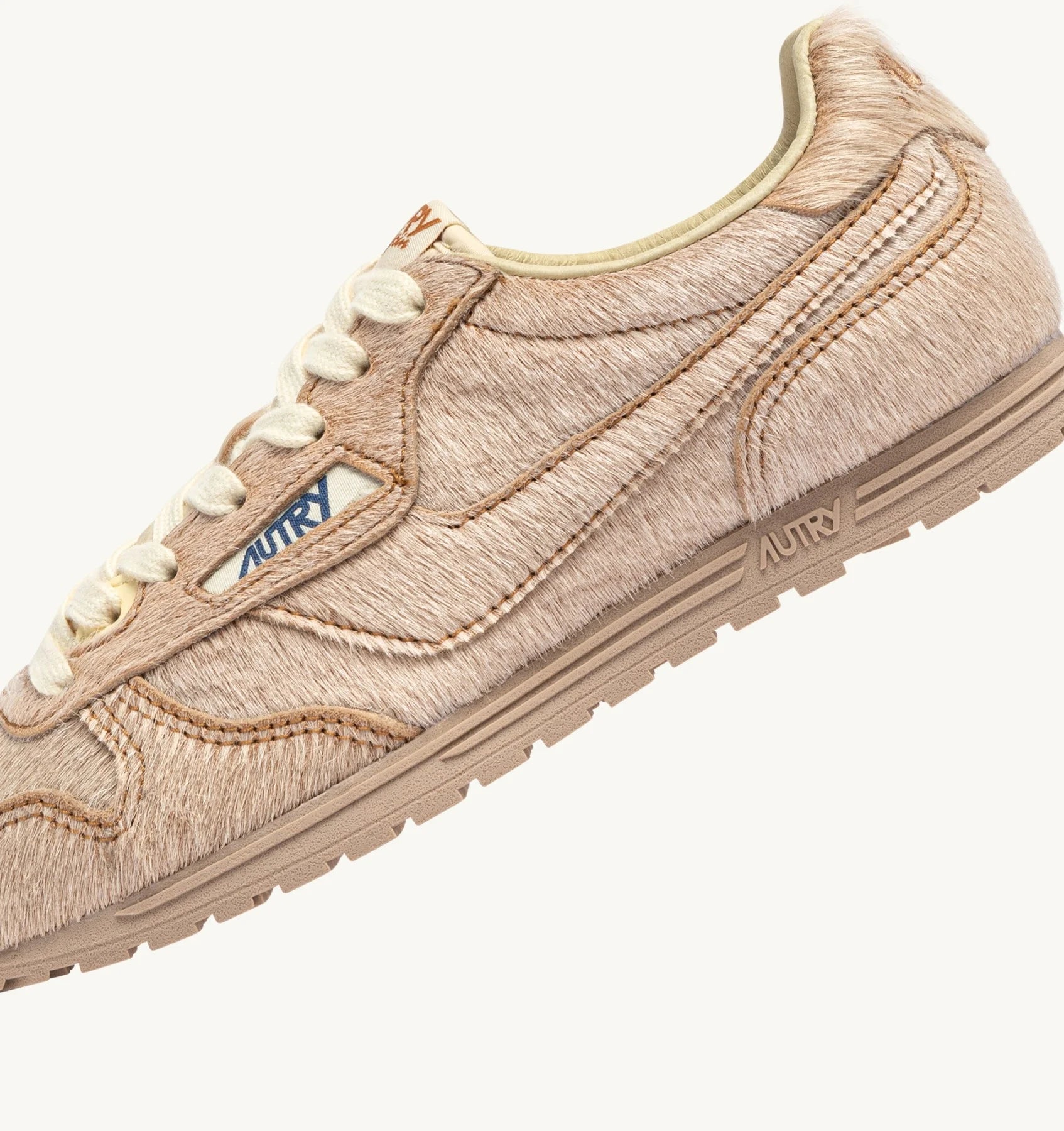 WINDSPIN SNEAKERS IN IVORY PONY SKIN EFFECT MATERIALL