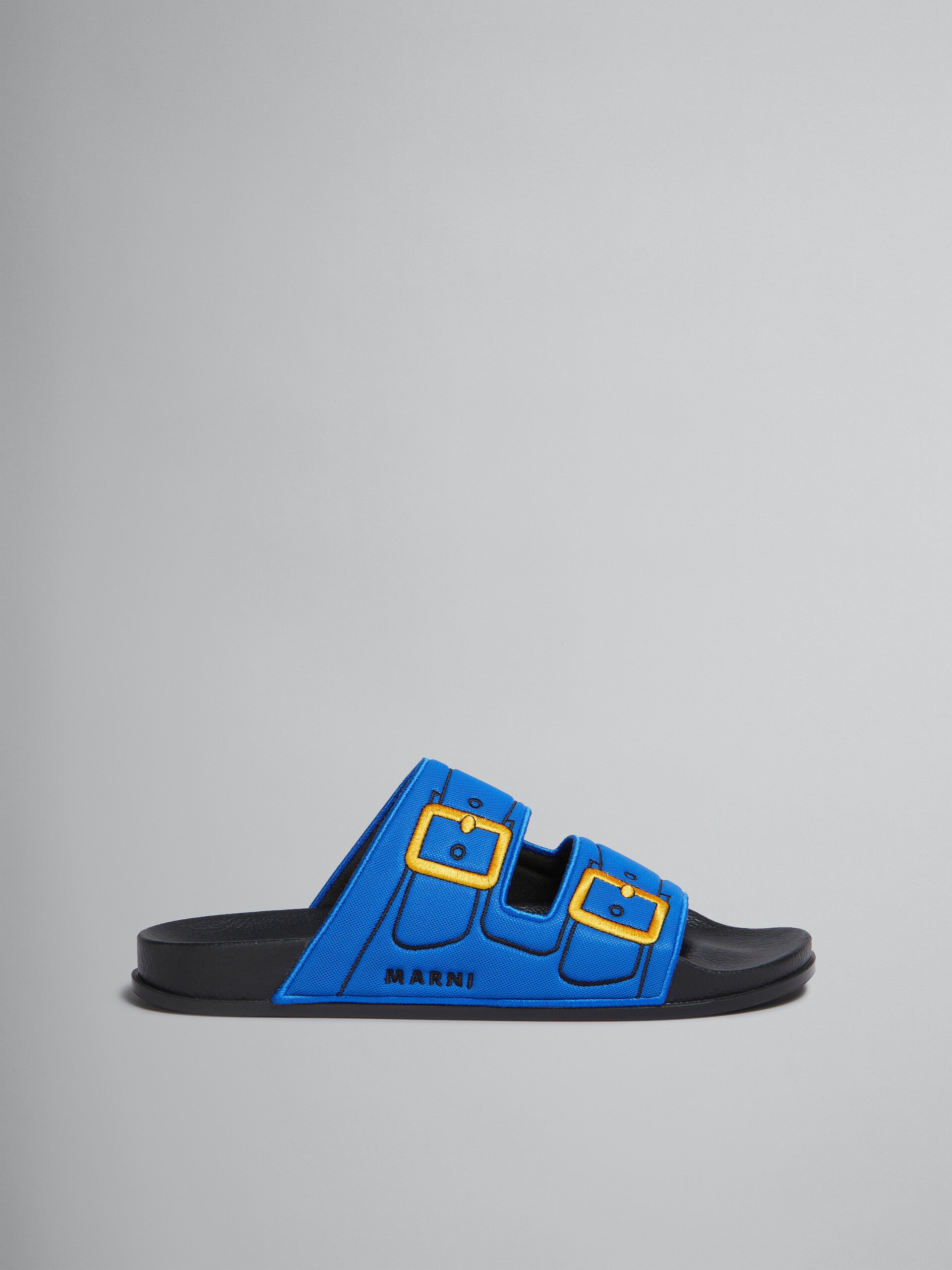 BLUE TROMPE L'OEIL SLIDER WITH EMBROIDERED BUCKLES