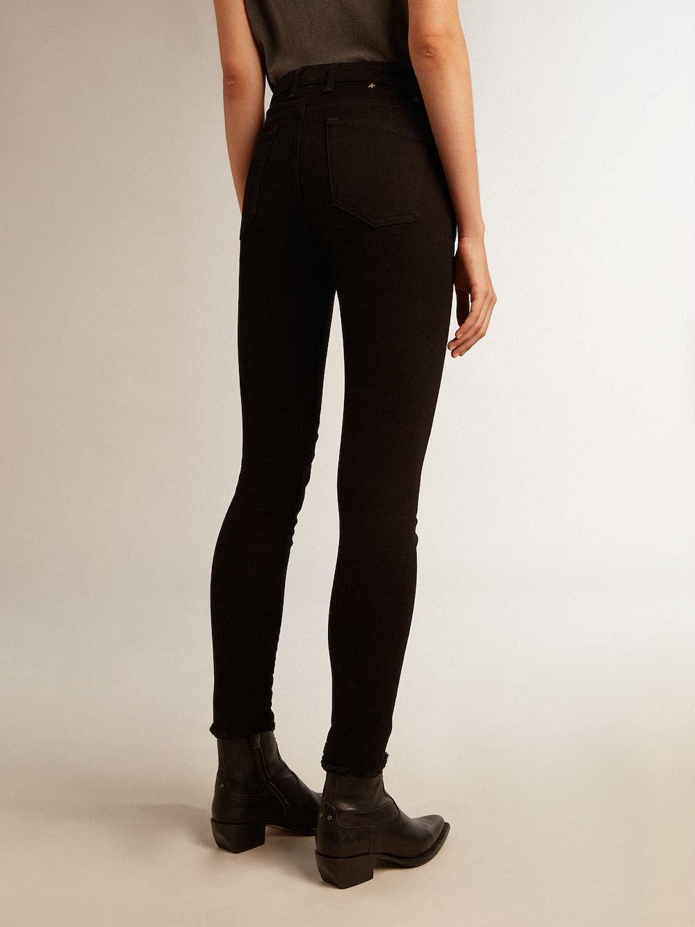 Woman’s black skinny jeans