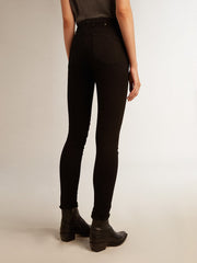 Woman’s black skinny jeans